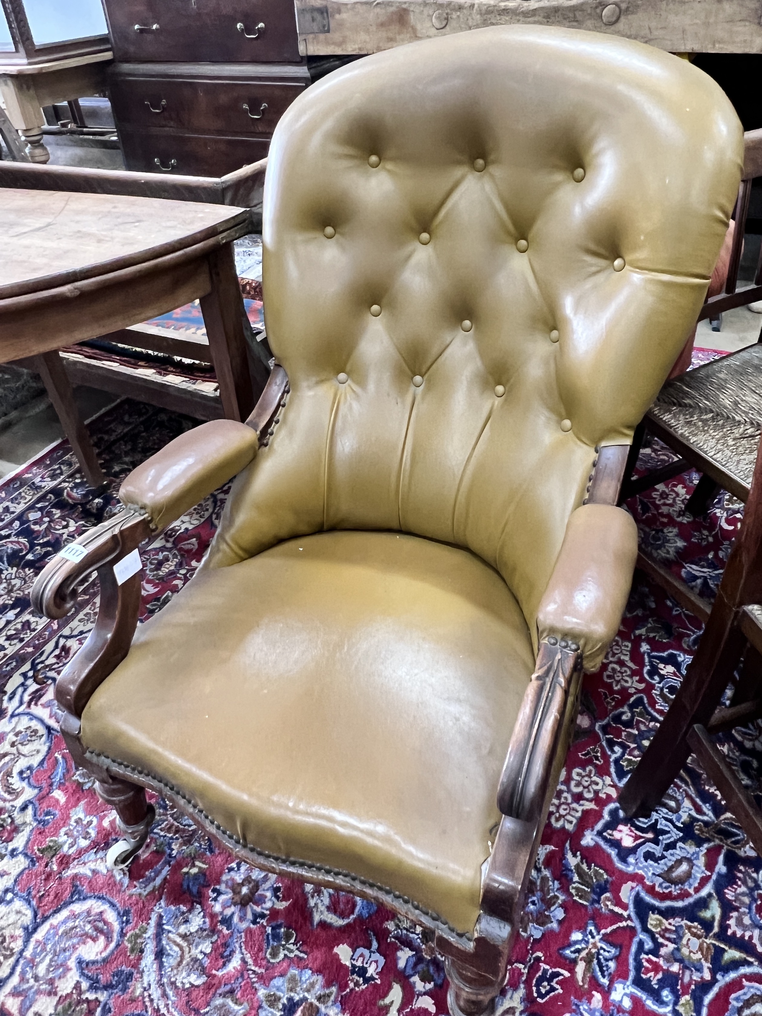 A Victorian mahogany spoonback open armchair, width 63cm, height 84cm